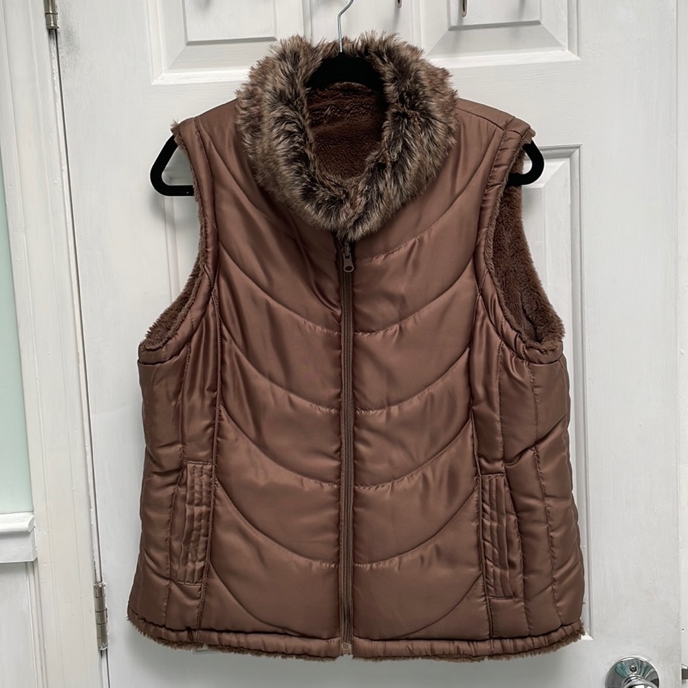 Reversible Fleece lined ladies vest jacket.  Two front pockets.  Very warm